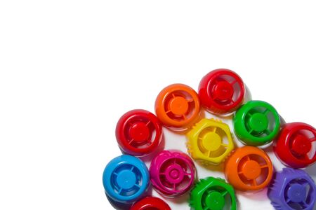 Colored Plastic corks from bottles on a white background. The pollution of Earth. Recycling used plastic. Problem of plastic contamination. Copyspacefor textの写真素材