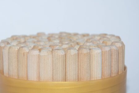 bamboo sticks in a round golden shape on grey background.の写真素材