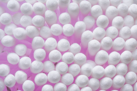 White cotton swabs background, closeup. Concept of hygiene, medicine, health care beauty