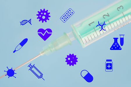 Emoticon icons healthcare medical symbol against the background of a medical disposable syringe. Healthcare and medical Insurance conceptの写真素材