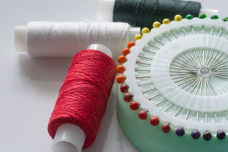 Sewing tools and kit on a white background. Accessories and equipment for needlework. Close up viewの写真素材