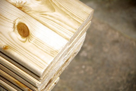 Pine boards stacked in a hardware store. Construction material.