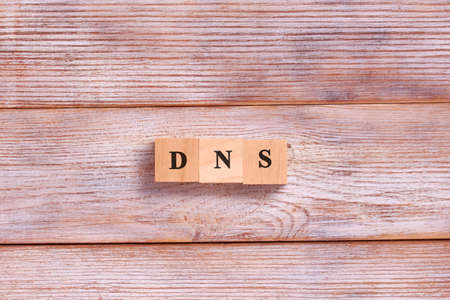 DNS word letters on wooden blocks. Domain Name System. Network, web, communication, technology conceptの写真素材