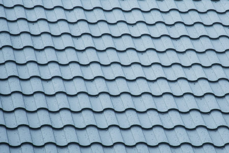 Blurred New metal roof with water drops after rain. Roof construction site. Metal roofing