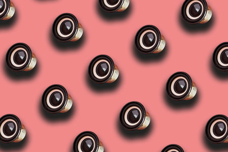 Black Audio Speaker on pink background. Minimal creative bold colored music pattern. Top view...