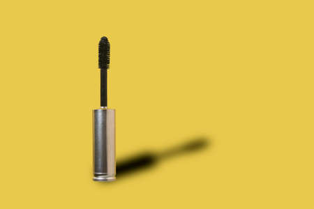 Black Mascara Brush with battery. Social mockup with copy space. Minimal beauty modern industry conceptの写真素材
