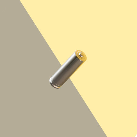 Levitation alkaline rechargeable battery on gray and yellow backdrop. Minimal electronic concept