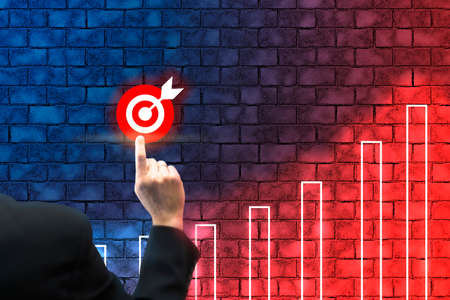 Businessman touching growing graph on virtual screen with business strategy plan. Business targeting, aiming conceptの写真素材