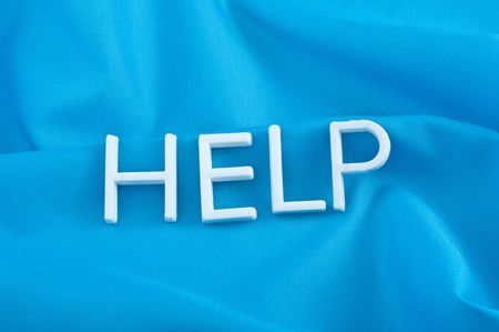 Help letters  on  blue backgroundの写真素材