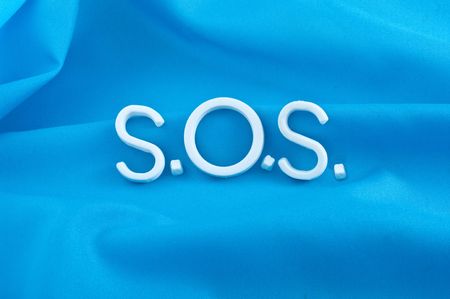 S.O.S. letters  on  blue backgroundの写真素材