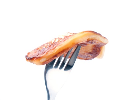 Cooking pancakes on a white background.の写真素材