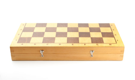 Closeup of an old closed wooden chessboard on white background