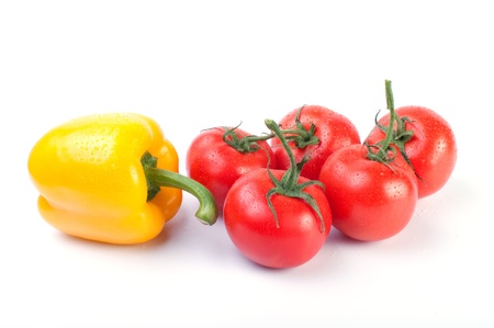 Fresh tomatoes and pepper  isolated on white backgroundの写真素材