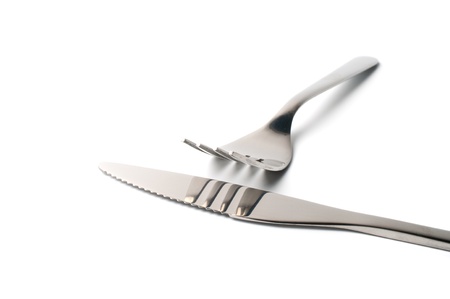 	Fork and knife isolated on white background	の写真素材