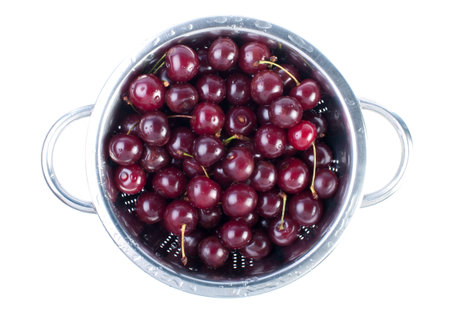 Fresh cherries on metal bowl