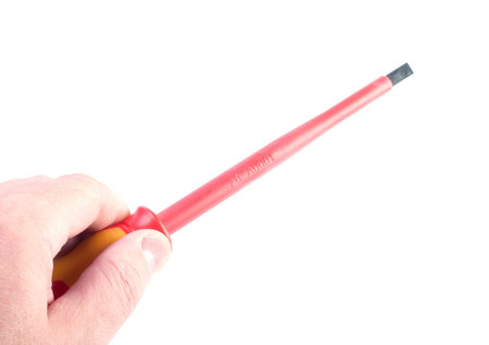 Hand  with a set of screwdrivers on the white backgroundの写真素材