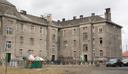 PREROV, CZECH REPUBLIC, MARCH 5, 2017: Ghetto poor in Prerov, Kojetinska street with courtyard Gypsy residents, authentic real situations, people gypsies, container full of rubbish, Europe, EUのeditorial素材