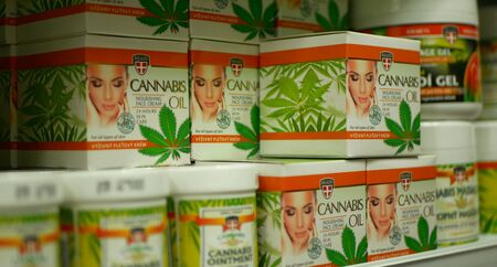 PRAGUE, CZECH REPUBLIC, SEPTEMBER 9, 2019: Cream oil medicinal cannabis hemp and cannabidiol CBD, shop or store Prague, quality for production of ointments, plastic packagingのeditorial素材