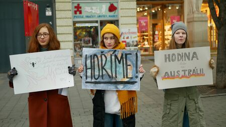 BRNO, CZECH REPUBLIC, JANUARY 10, 2019: Friday for future, activists and activism demonstration climate change fire bushfires Australia, banner sign Burning, crowd young people students high schoolのeditorial素材