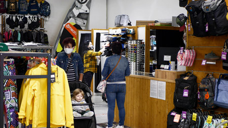 PRAGUE, CZECH REPUBLIC, JUNE 22, 2020: Coronavirus mask face clothing fashion store, backpacks, bag...