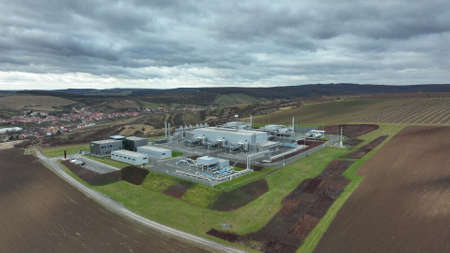 DAMBORICE, CZECH REPUBLIC, NOVEMBER 15, 2021: Oil gas natural plant factory drone aerial view processing storages tanks fossil pipes refinery pumpjack fracking extraction pump jack machine fieldのeditorial素材