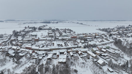 Village winter frost snow drone aerial magic snowy icing ice Bolelouc snowfall. Hana houses scenery cottage and garden magical landscape country Moravia Europeの写真素材
