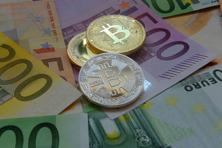 Euro in banknotes and coin bitcoinの写真素材