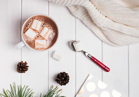 Hot cocoa with marshmallows on white table, top viewの写真素材