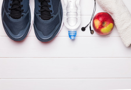 Fitness or running stuff on white wooden background, top viewの写真素材