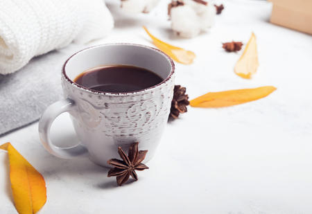 Coffee, sweaters and yellow leavesの写真素材
