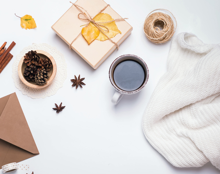 Coffee, sweater, pine cones and other small autumn related itemsの写真素材