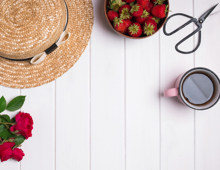 Rustic summer accessories on the white wooden backgroundの写真素材