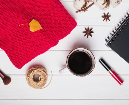Red sweater, coffee and other small items. Autumn conceptの写真素材
