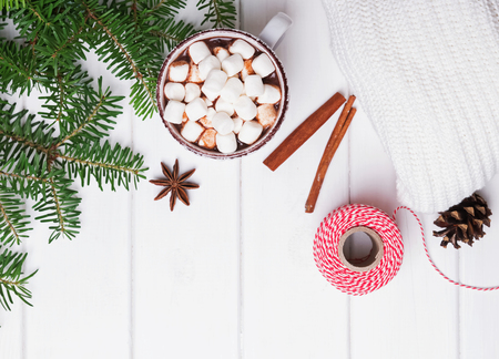 Hot cocoa and fir branches on the white table. Christmas morning.の写真素材