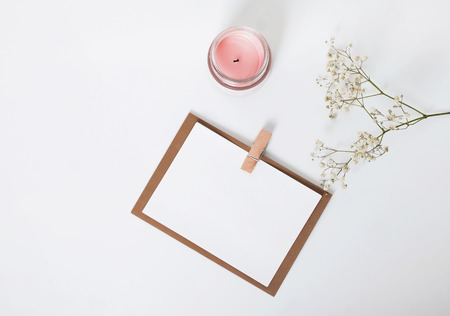 Mock up in minimalist style with gypsophila and pink candleの写真素材