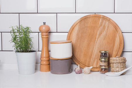 Modern trendy kitchen details. Herbs and spices on the  background of white brick tile wall.の写真素材