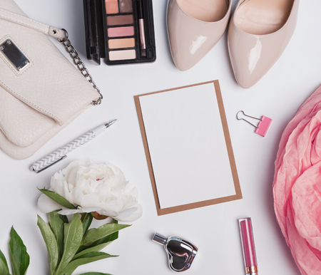 Women's accessories on white background and blank paper, top viewの写真素材