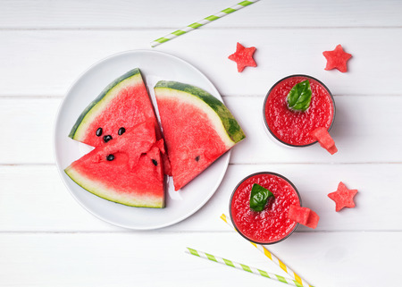 Two glasses with delicious refreshing watermelon smoothie on theの写真素材