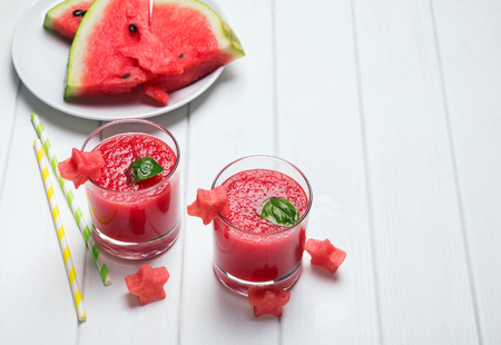 Two glasses with delicious refreshing watermelon smoothieの写真素材