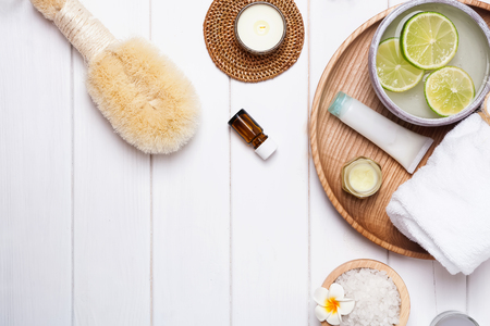 Spa essentials on the white wooden background, top viewの写真素材