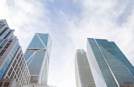 Modern city panorama. Tall skyscrapers, view from the ground, toned photo.の写真素材