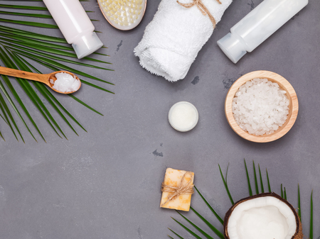 Coconut oil bodycare concept. Coconut, brush and other spa related items, top viewの写真素材