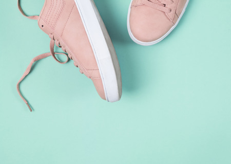 Pink sneakers on the pastel green background. Fashion blog conceptの写真素材