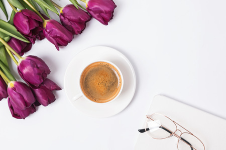 Tulips and coffee on the white backgroundの写真素材