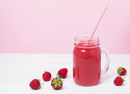 Delicious strawberry smoothie in a jarの写真素材