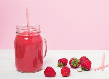 Delicious strawberry smoothie in a jarの写真素材