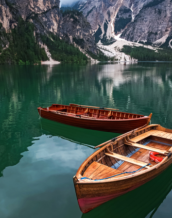 Wooden boats on the beautiful lake Braies,の写真素材