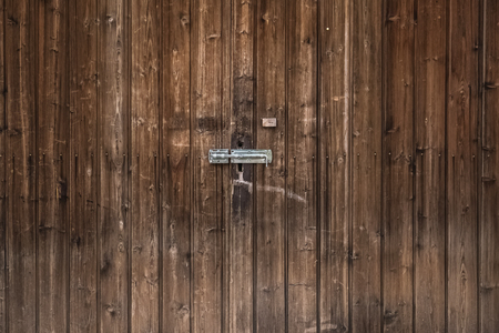 Old wooden barn doors close-up.の写真素材