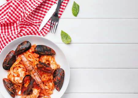 Seafood pasta in tomato sauce with shrimps and musselの写真素材