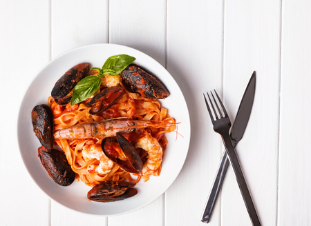 Delicious seafood pasta with shrimps and mussels in tomato sauceの写真素材